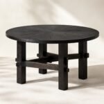 Masă de dining rotundă Minka din lemn ars cu bază tradițională cu traverse, imagine principală generată