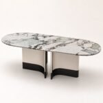 Masă de dining Lunaria cu blat oval marmorat și baze curbate bicolore, perspectivă alternativă generată