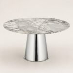 Masă de dining rotundă Argentia cu blat mineral perlat și soclu conic oglindit, imagine principală generată