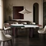 Masă de dining Intarsia cu blat mineral policrom și baze curbate – ambient de dining generat